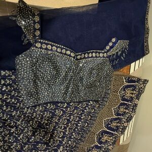 Brand new Beautiful Blue, golden with silver crystals.